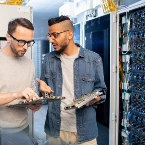 IT engineers fixing motherboard