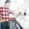 Man using laptop in publishing office