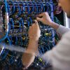 Man Working with Server Cabinet