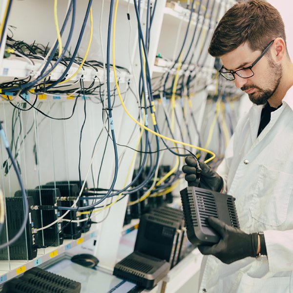 Network technician testing modems