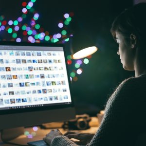 Photographer viewing pictures on the computer